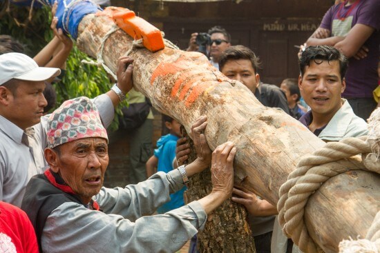 BHAKTAPUR, NEPAL - APRIL 12, 2016: Locals erect Yoshin Pole at Pottery Square.